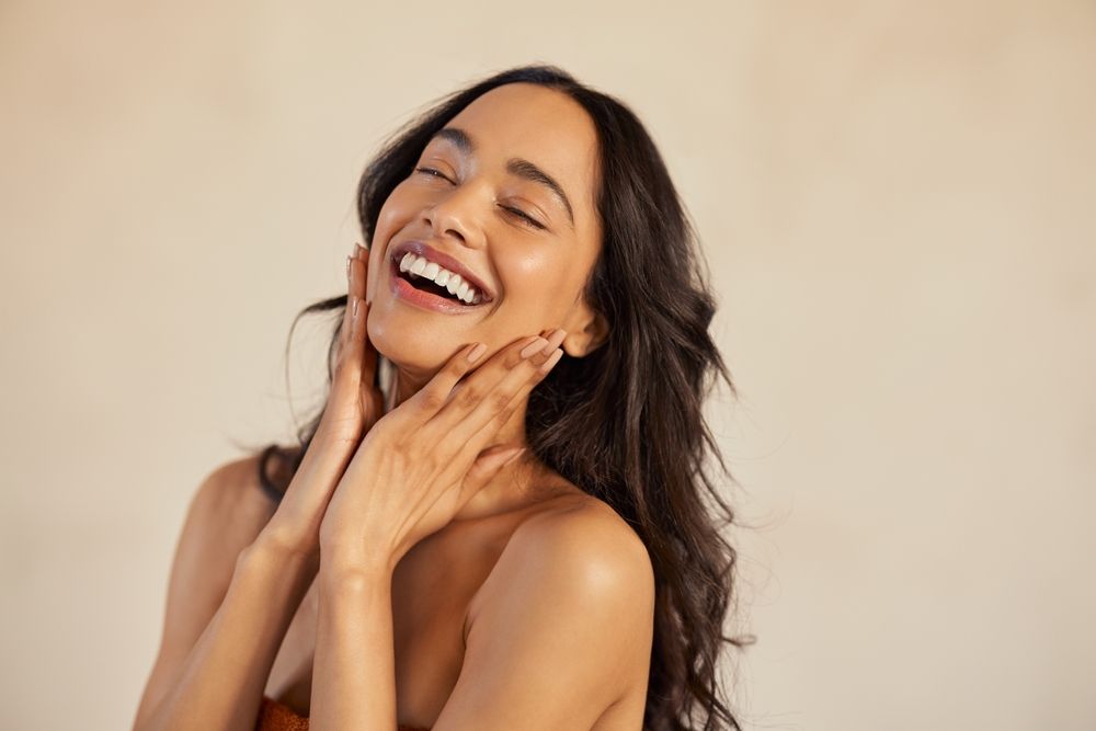 beautiful woman with long brown hair is smiling